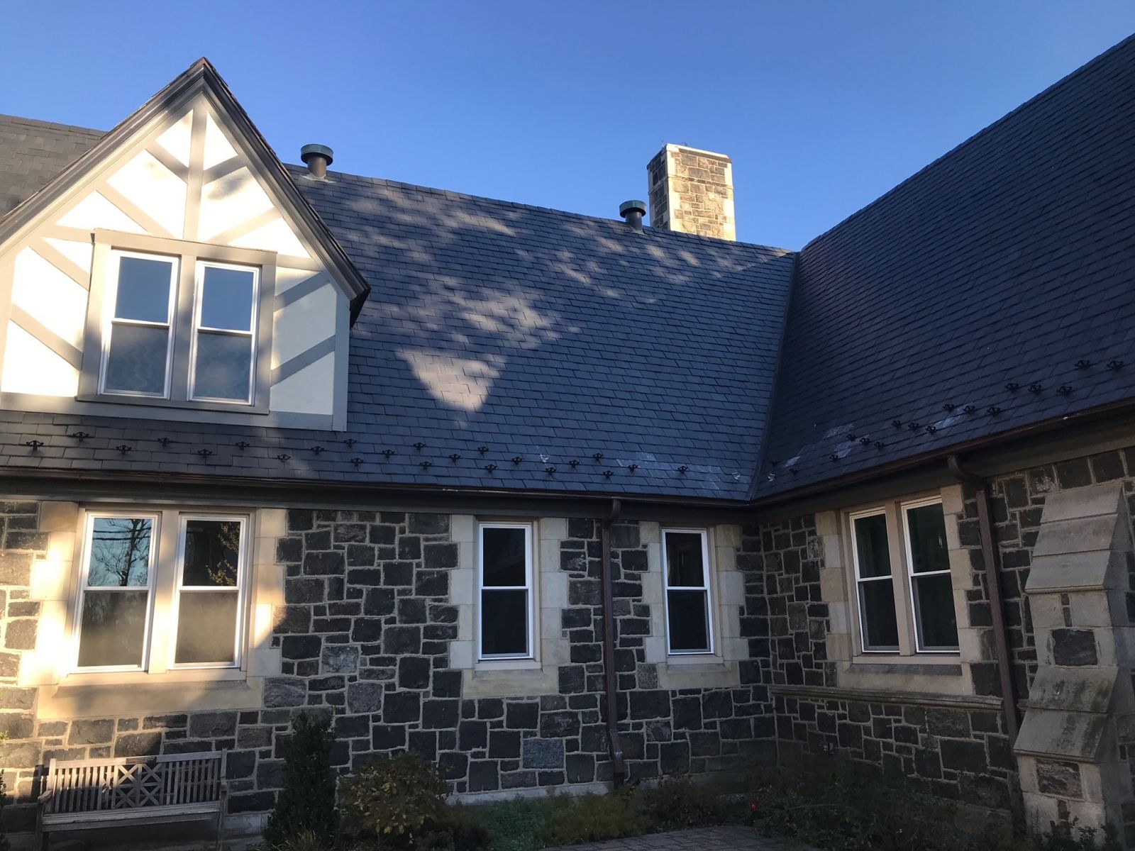 Close up of a Allsite Roofing LLC worker installing new Commercial Metal roof