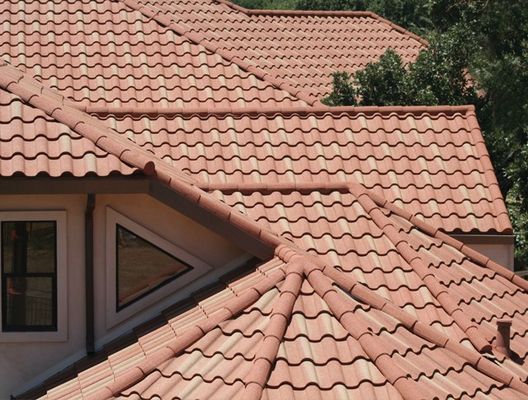 Close up of a Allsite Roofing LLC worker installing new Tile roof